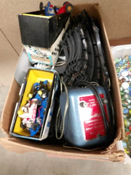 A box of vintage Scalextrix including cars,