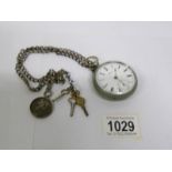 A Waltham pocket watch (working), a silver watch chain,