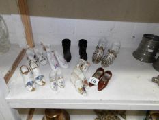 A quantity of Victorian and porcelain shoes