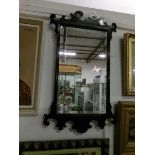 A mahogany framed mirror with bevelled edge