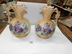 A pair of Austrian hand painted ewers
