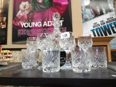 A cut glass decanter and glasses