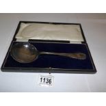 A cased silver desert spoon Hallmarked for London 1919,