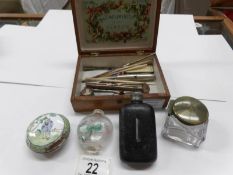A wooden box and contents including hip flask,