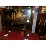 A Chinese lacquered drop leaf table