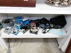 A Ricoh SLR camera, lenses, cases,