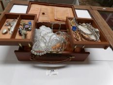 A jewellery case and contents including crystal necklace