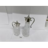 2 glass claret jugs with plated tops and mask spouts