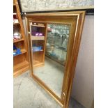 A large gilt framed mirror