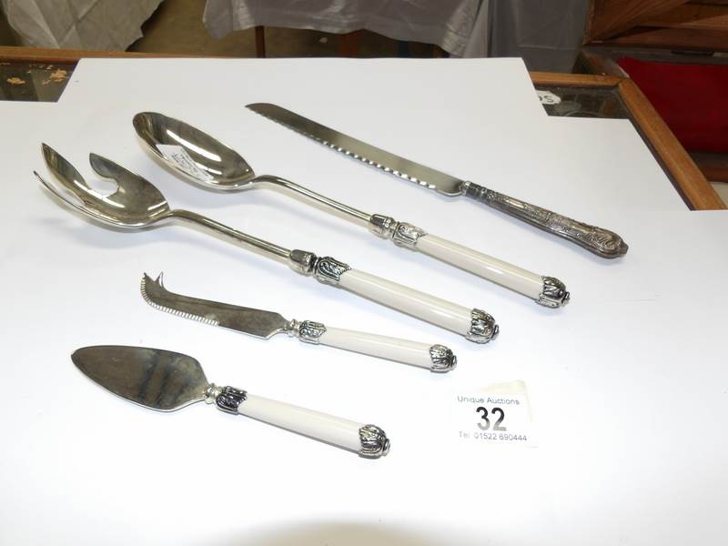 A superb quality salad and cheese server set and a silver handled bread knife