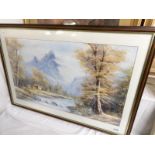 A framed and glazed mountain scene watercolour