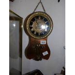 An unusual copper wall clock