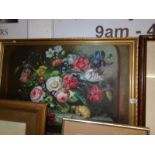 A large gilt framed oil on canvas floral arrangement
