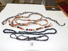 A quantity of coloured stone necklaces