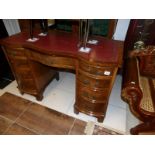 A good quality walnut kneehole desk