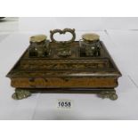 A Regency (circa 1820) lacquer and Chinioserie desk tidy complete with inkwells