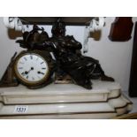 A French mantel clock surmounted bronze figure