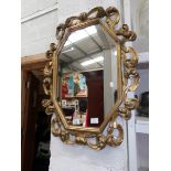 A gilt framed mirror,