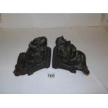 A pair of early 'Monk' book ends