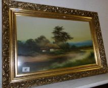 A gilt framed and glazed oil painting thatched cottage scene under diffused glass,