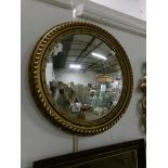 A gilt framed circular convex mirror,