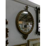 A Victorian oval gilt framed mirror,