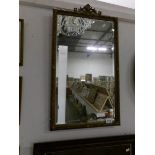 A Victorian bevel edged mirror in Adam style frame,