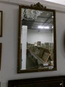 A Victorian bevel edged mirror in Adam style frame,