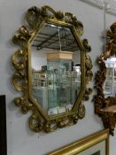 A gilt framed Victorian mirror,