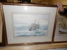 A framed and glazed watercolour of a tall ship in sail and on stormy seas, signed David G Bell,