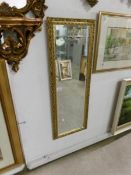 A gilt framed bevel edged mirror,