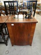 A Frister and Rossman cabinet sewing machine