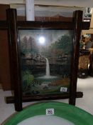 A framed mixed media waterfall painting signed R Pind