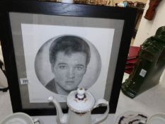 An authenticated print of Elvis signed by the artist on the reverse