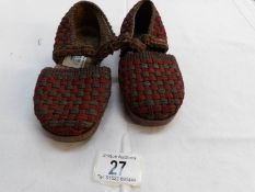 A pair of vintage child's shoes with wooden soles