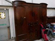 A Victorian inlaid combination wardrobe with centre bank of drawers
