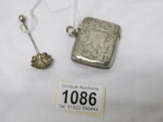 A silver vesta case, Birmingham 1897/98 and a silver salt spoon,