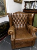 A leather wing arm chair