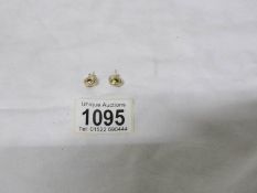 A pair of 9ct gold stud earrings