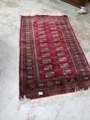 A good quality red patterned rug