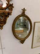 A Victorian oval mirror