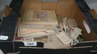 A collection of gramaphone records and cigarette cards