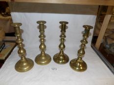 A set of 4 brass candlesticks