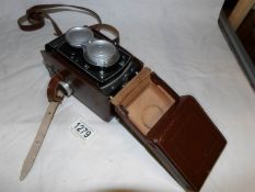 A leather cased Roliecord camera
