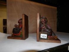 A pair of circa 1940's Bavarian had carved wooden book ends
