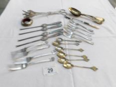 A mixed lot of cutlery including lobster forks