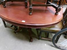 A Victorian mahogany oval centre pedestal table