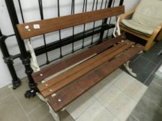 A metal and wood garden bench
