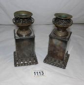 A pair of Victorian silver plated oil lamps converted to candlesticks