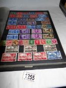 An album of stamps including over 70 mint commemorative sets dated back to 1964 and many used in a